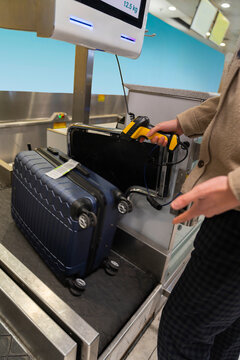 Man Using Self Drop-Off Service at Airport Check-In