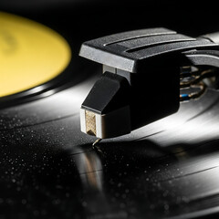 Close up shot of a turntable needle on a spinning vinyl record