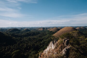Fototapeta premium Breathtaking view of Chocolate Hills in lush forest landscape