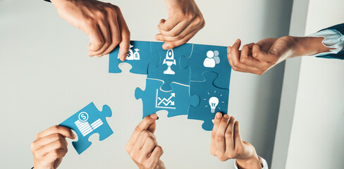 A dynamic image showcasing diverse hands assembling a puzzle, representing teamwork, strategy, and...