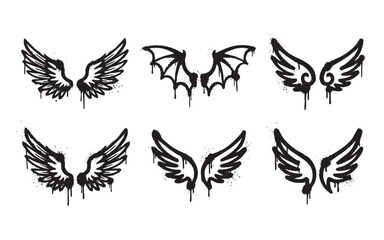 Obraz premium Set of graffiti spray paint wings including angel, bird, and devil bat styles with grunge dripping texture