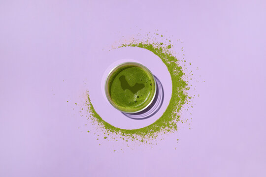 Overhead shot of a matcha latte in a clear glass
