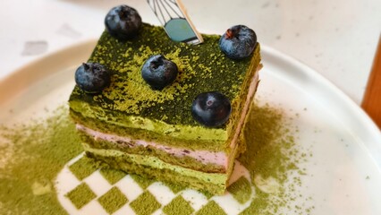 Blueberry Matcha Cake with Vibrant Green Tea Layers and Fresh Berry Topping