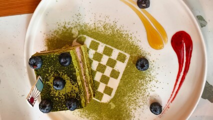 Blueberry Matcha Cake with Vibrant Green Tea Layers and Fresh Berry Topping