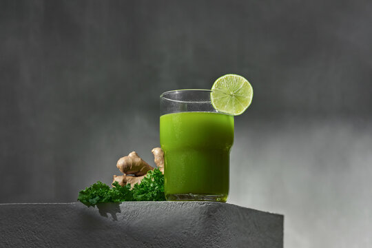 A vibrant green detox juice featuring fresh vegetables