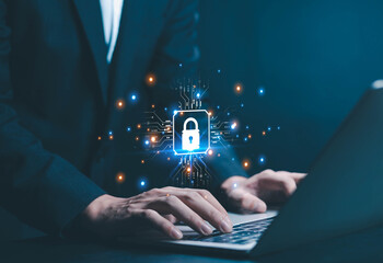 Business professional using laptop with digital lock and glowing circuit lines, representing cybersecurity, data protection, network security, online privacy, information technology