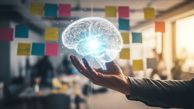 Hand holding glowing digital brain for artificial intelligence concept