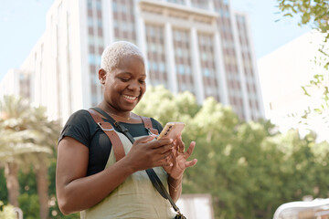 Woman texting on Her Phone in a City