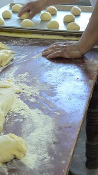 kneading the bread at the table