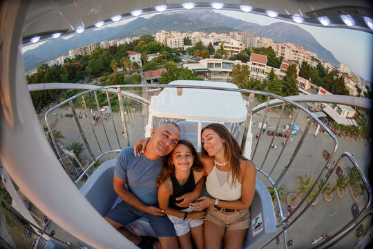 Family enjoys the ferris wheel ride