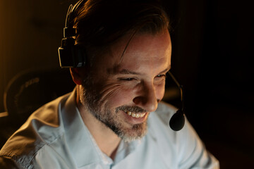 Mature man smiling using headset working call center