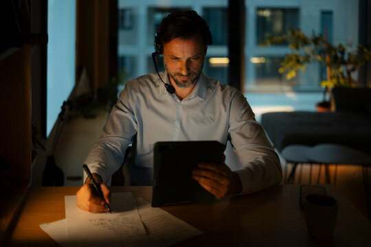 Man working late night from home office
