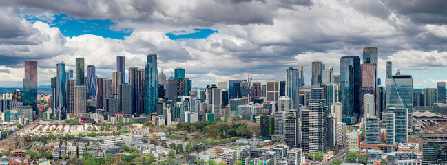 City skyline with dramatic clouds overhead
