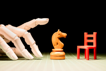 Creative chess game with wooden pieces and hand