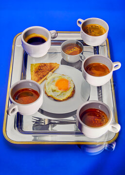 Breakfast set featuring multiple coffee cups