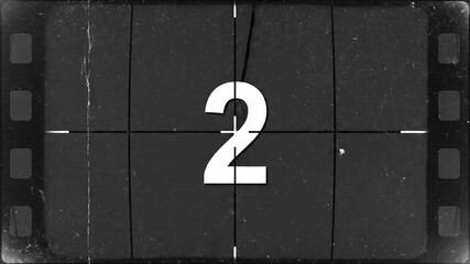 Vintage film countdown timer with numbers 5 to 0 displayed on a scratched screen.