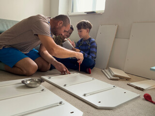Father and Son Assemble Furniture Together in Cozy Living Room