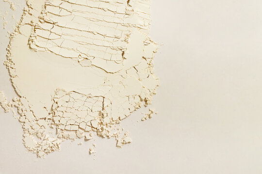 Cracked Beige Powder Revealing Texture and Layers