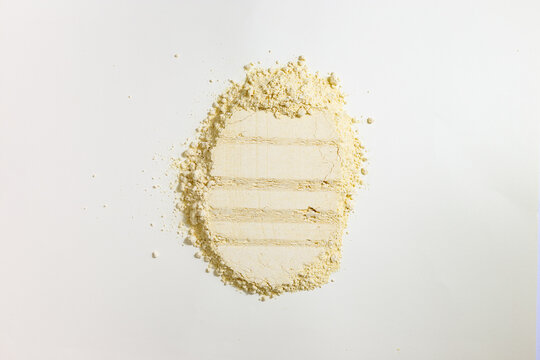 Fine Powder Arranged on a Flat Surface With Visible Stripes