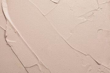 Textured Beige Wall With Smooth and Rough Patterns in a Modern Setting