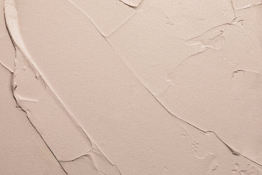 Textured Beige Wall With Smooth and Rough Patterns in a Modern Setting