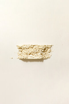 Yellow Powder Spread on a Light Background in a Clean Setting