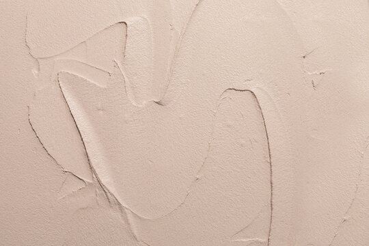 Crafted Wall Texture Features Smooth Plaster in a Soft Beige Color