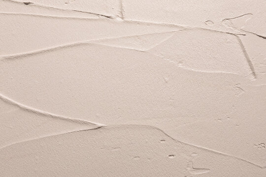Textured Wall Surface With Abstract Lines and Patterns in Beige Tones