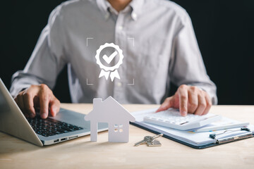 Business person calculates property value analyzing home market price with laptop and calculator, reviewing real estate data for potential increase and home loan planning, showing quality checkmark