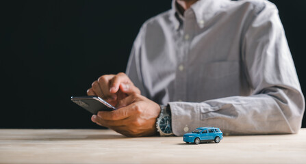 Person uses smartphone for online car marketplace shopping, exploring auto listings, ready to buy or sell vehicle on website, perfect for digital purchase sale business