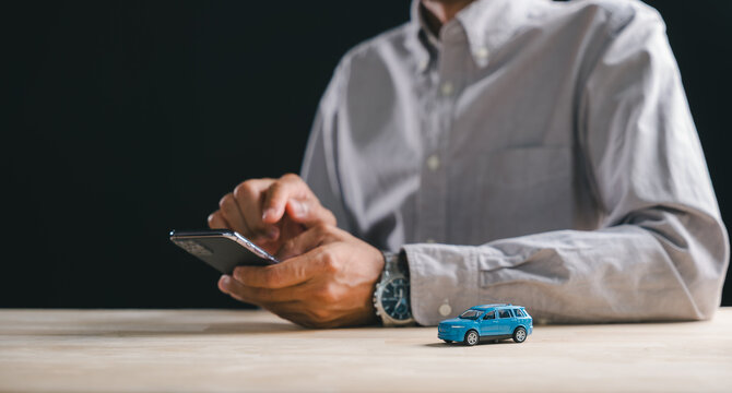Person uses smartphone for online car marketplace shopping, exploring auto listings, ready to buy or sell vehicle on website, perfect for digital purchase sale business