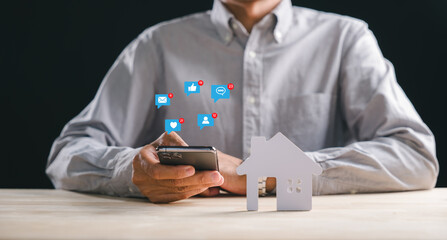 Loan concept for new home property, person holding smartphone displaying social media notifications for real estate investment opportunities, buying house, finance planning