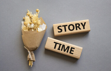 Story Time symbol. Wooden blocks with words Story Time. Beautiful grey background. Business and Story Time concept. Copy space.