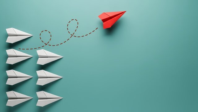 Red paper plane breaking away from a group of white paper planes on a teal background.