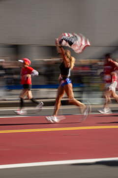 Runner Joyfully Celebrates Victory With American Flag