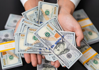 Riches and success. Rich businessman saving cash money. Financial saving success. Successful rich man with money. Business success man hold dollar. Millionaire hold dollar money. Wealth in dollars