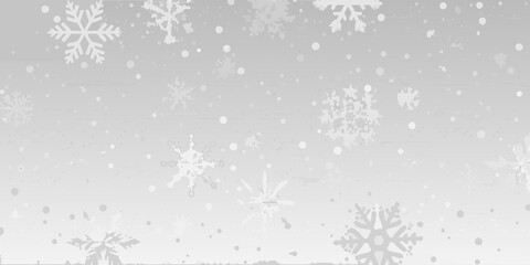 Obraz premium Falling snowflakes create a gentle winter scene with a soft muted palette