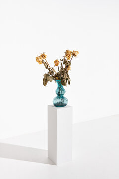 Yellow Roses in Blue Glass Vase