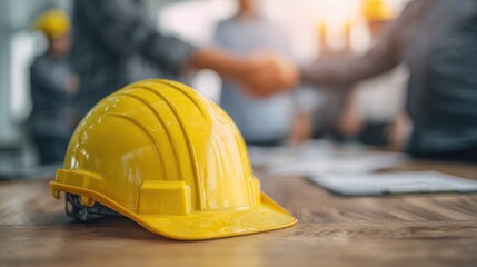 Yellow hard hat on wooden surface