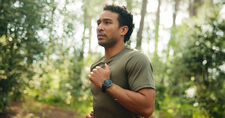 Fitness, workout and man in nature with running, cardio and stamina training in sport challenge. Wellness, bokeh and athlete in forest with jog, outdoor trail and endurance exercise in Costa Rica.