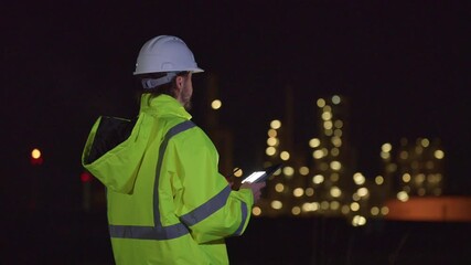 Engineers’ night shift working oil and gas refinery service, Workers hard work at night petroleum industry plant background, Oil and Gas Petrochemical industry.