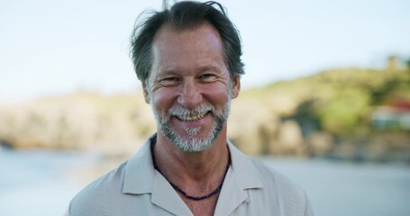 Mature, happy man and face with beach for morning health, wellness or awareness in nature. Portrait, male person or spiritual activist with smile or satisfaction on ocean coast for fresh air or start