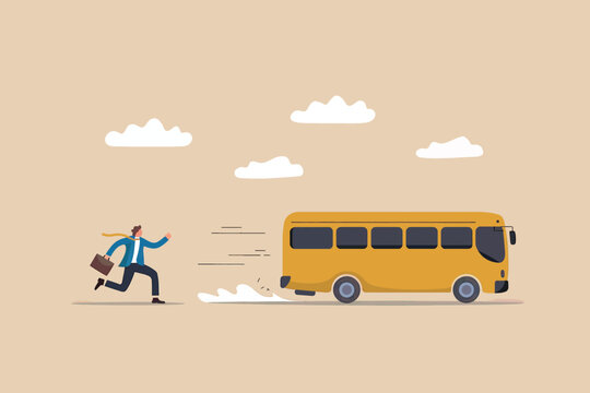 Man running to catch a departing yellow bus