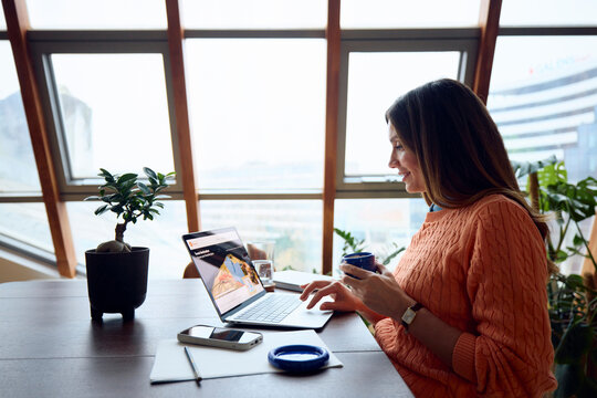 Woman uses laptop