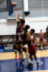 Blurred background of scoring during a basketball game