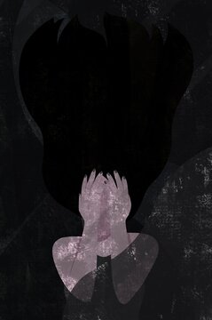 A Woman with her hands over her face surrounded by darkness.