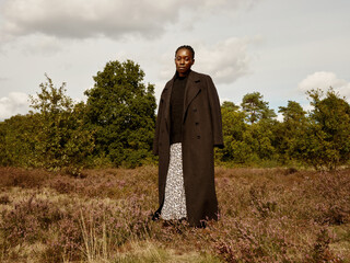 Elegant Black woman in Autumn outfit 