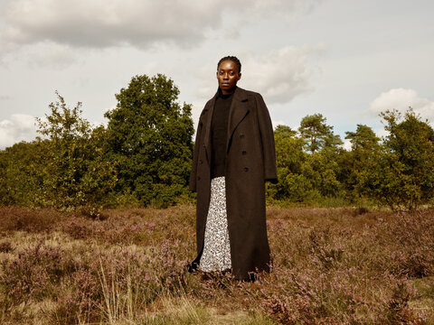 Elegant Black woman in Autumn outfit 