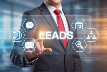 Businessman in a grey suit touching a digital "LEADS" interface with icons for global marketing, email, and networking. Concept of sales lead generation, customer acquisition, and business growth.
