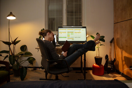 Woman feeling tired working from home late night